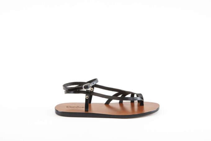 A black Palma sandal, seen from the side